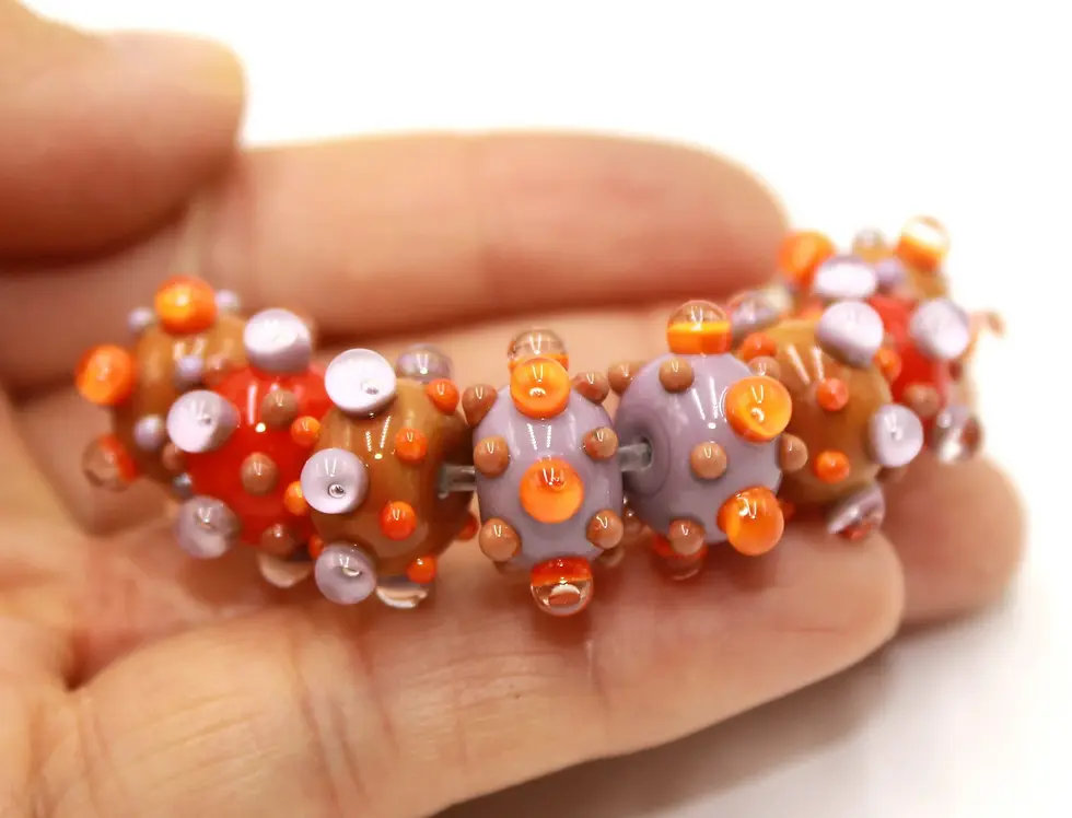 Carrot-Purple rondelle beads 12mm with raised dots