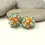 Thumbnail: Orange pair glass beads with raised dots 14mm