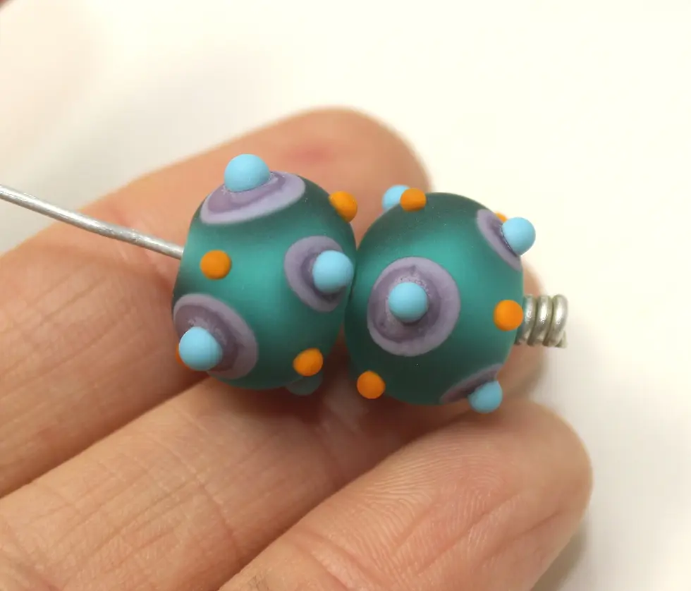 Teal Green etched pair beads with raised dots 14mm