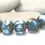 Thumbnail: blue etched glass beads