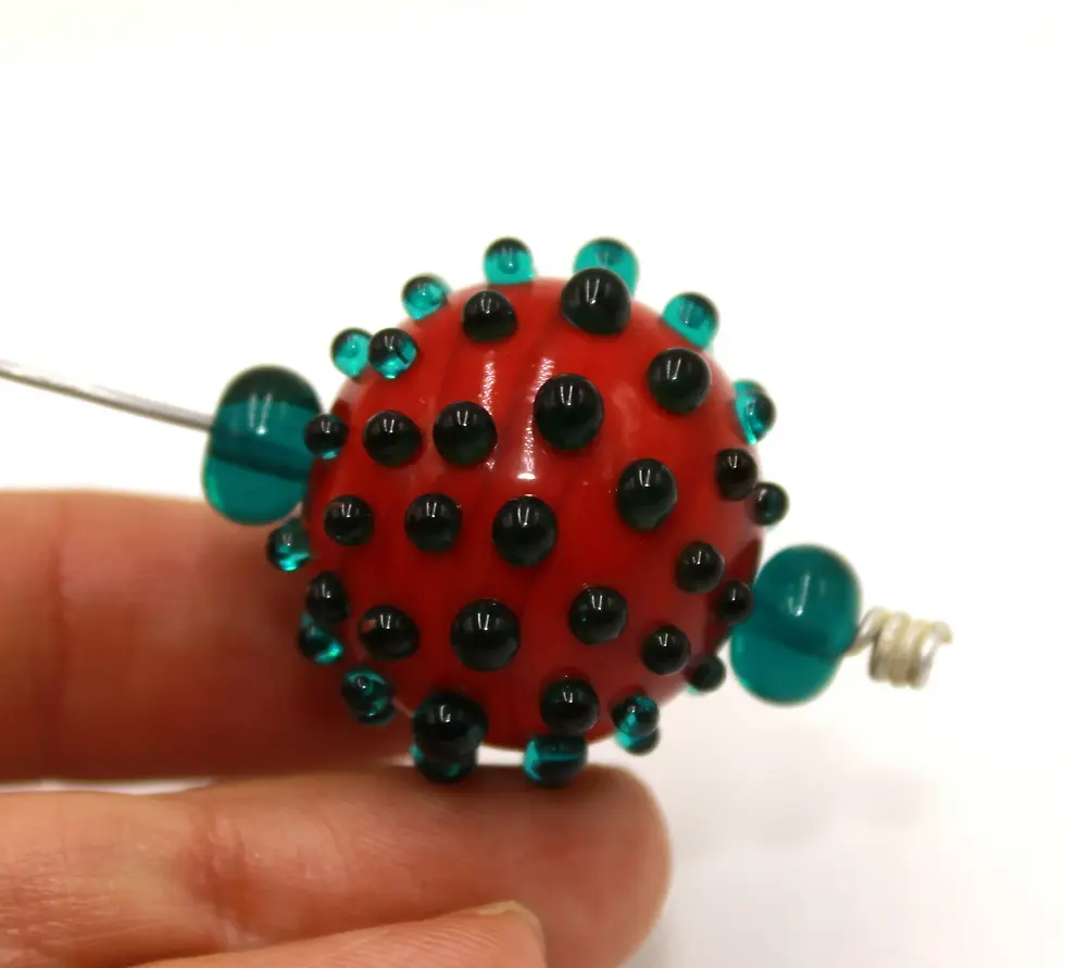 Burgundy hollow glass bead with raised dots 20(22)mm
