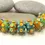Thumbnail: Green-Yellow rondelle beads 12mm with raised dots
