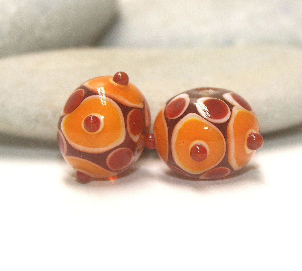 Red-Orange pair beads with raised dots 14mm