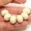 Thumbnail: Ivory rondelle beads 12mm with lava textured