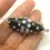 Thumbnail: Black pair cone beads with raised dots