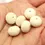 Thumbnail: Ivory rondelle beads 12mm with lava textured