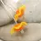 Thumbnail: Orange pair beads with ruffle