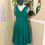 Thumbnail: Emerald green chiffon cross bodice dress with strappy under bodice front view on mannequin.
