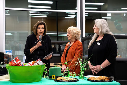 Photo of Patty Steur presenting a check to representatives of the La Crescenta Woman's Club in 2024.