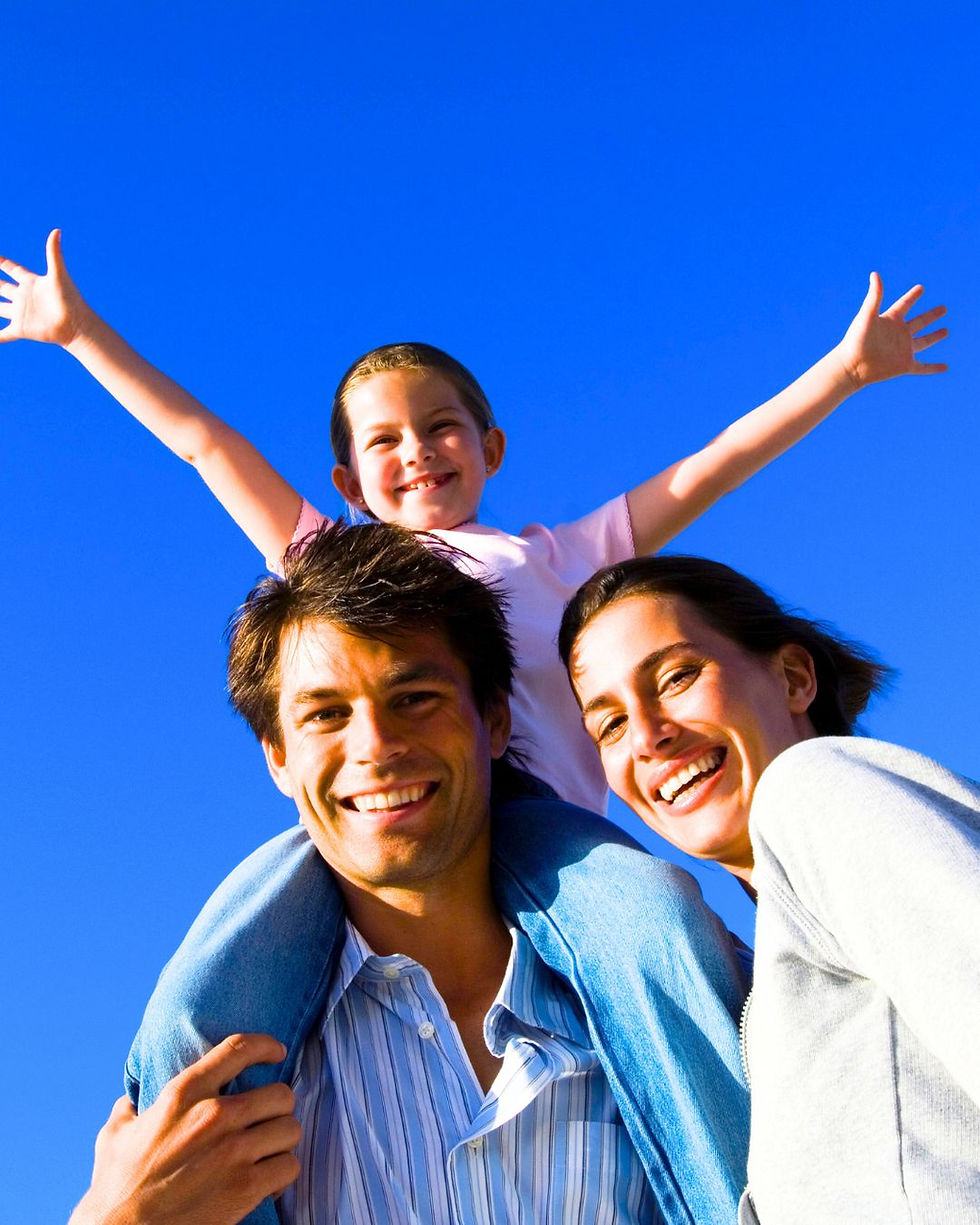 Happy family smiling with healthy teeth, celebrating care from a trusted Pittsburgh orthodontist