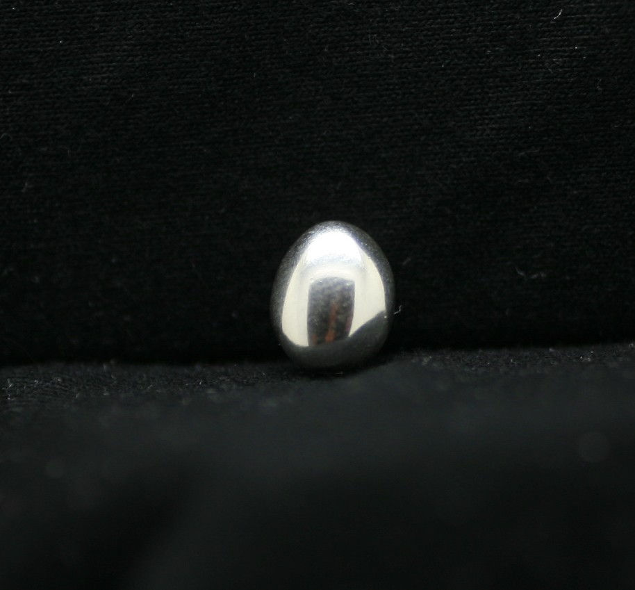 Thai silver rounded oval bead with a smooth texture
