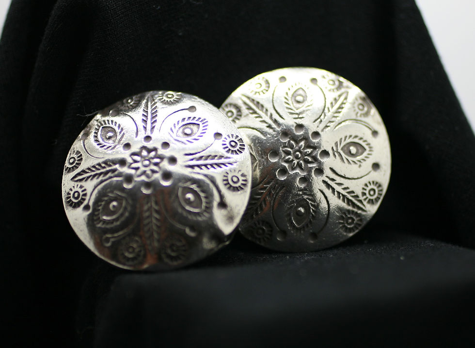 Thumbnail: Two fine silver circular beads with exotic flower patterns grooved into the smooth surface