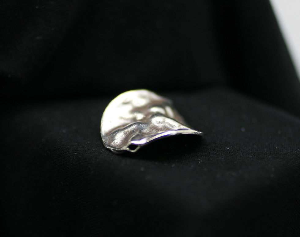 Karen Hill Tribe silver round spiraling bead with an irregular smooth surface
