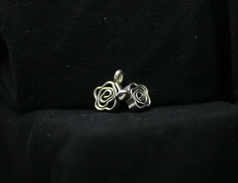 Thumbnail: Two Thai silver flower-shaped beads with a loop