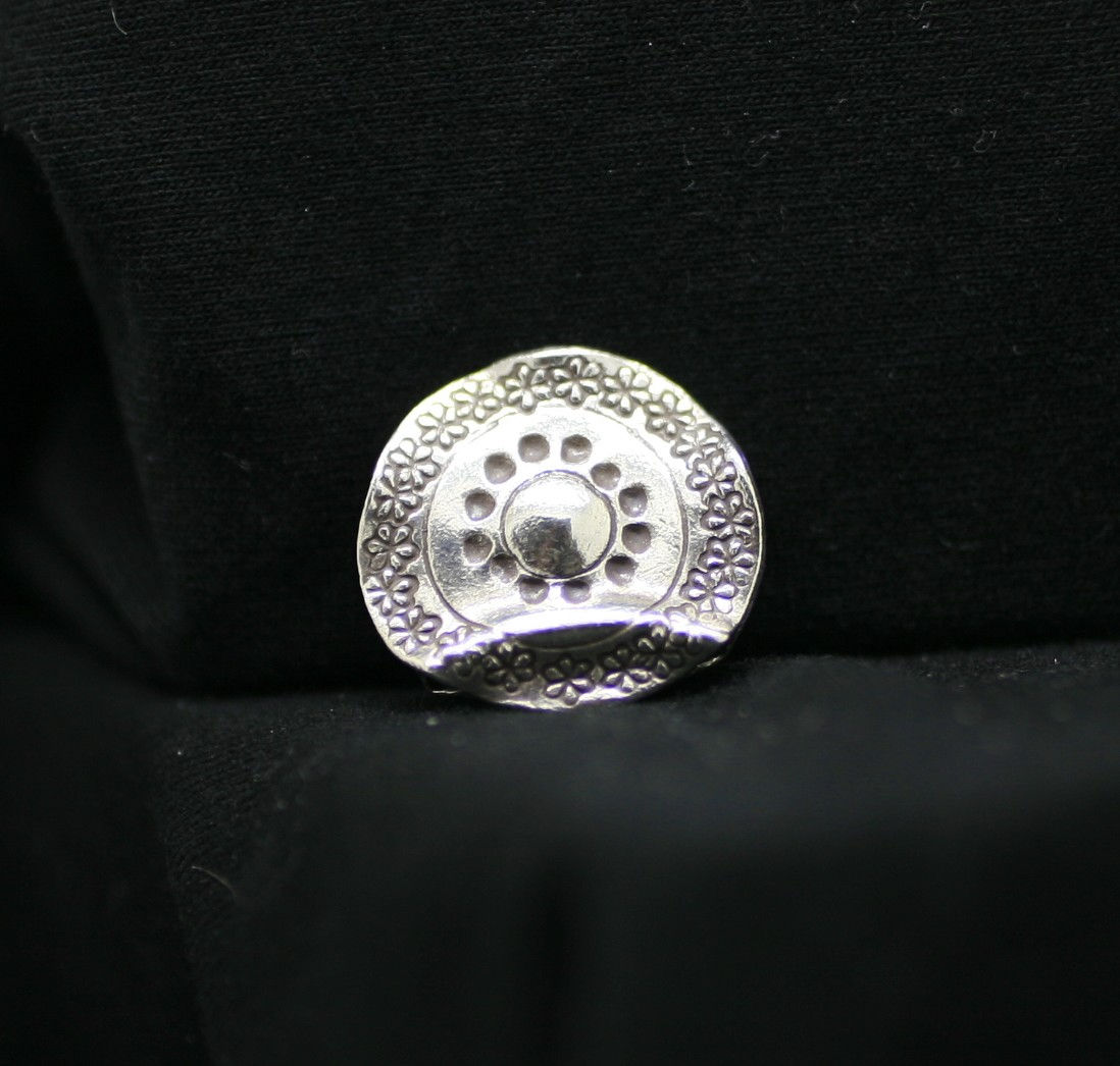 Thai silver circular bead with a curved ridge, frilly edges and unique cobbled/circle surface designs
