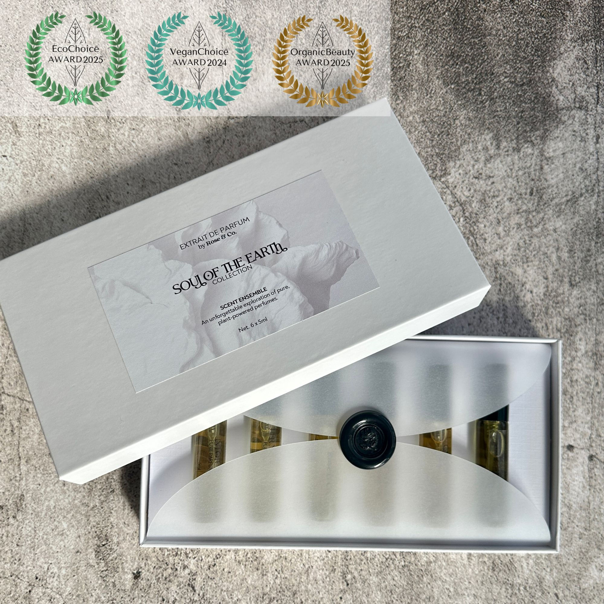 A white box with 6 small natural perfume bottles