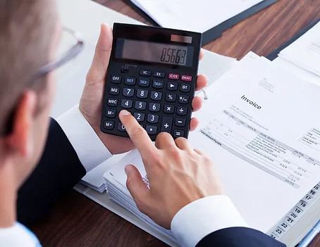 depositphotos_29295163-stock-photo-businessman-using-calculator.jpg
