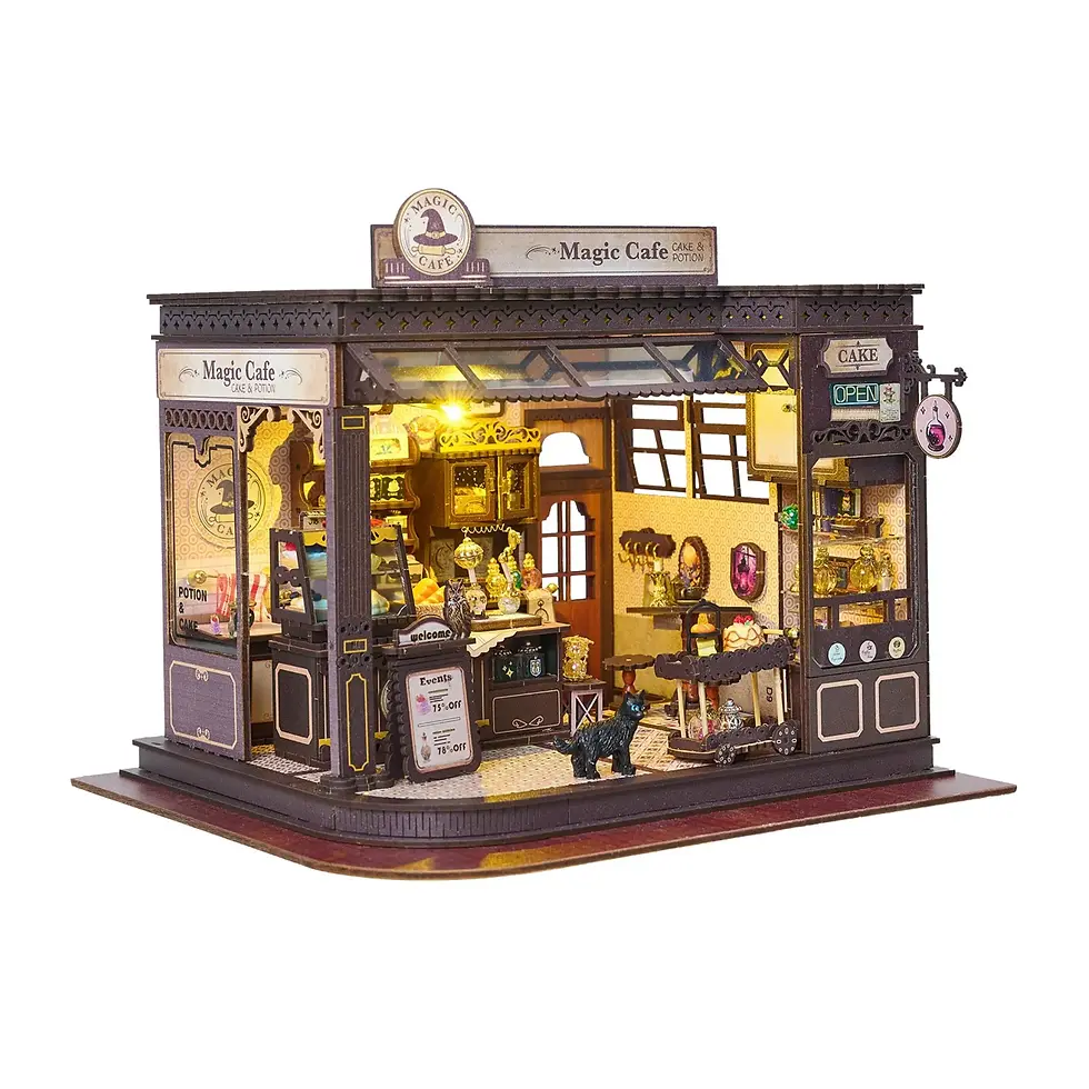 Magic café house kit by HandCraft with miniature furniture, pastries, shelves, and cozy LED lighting