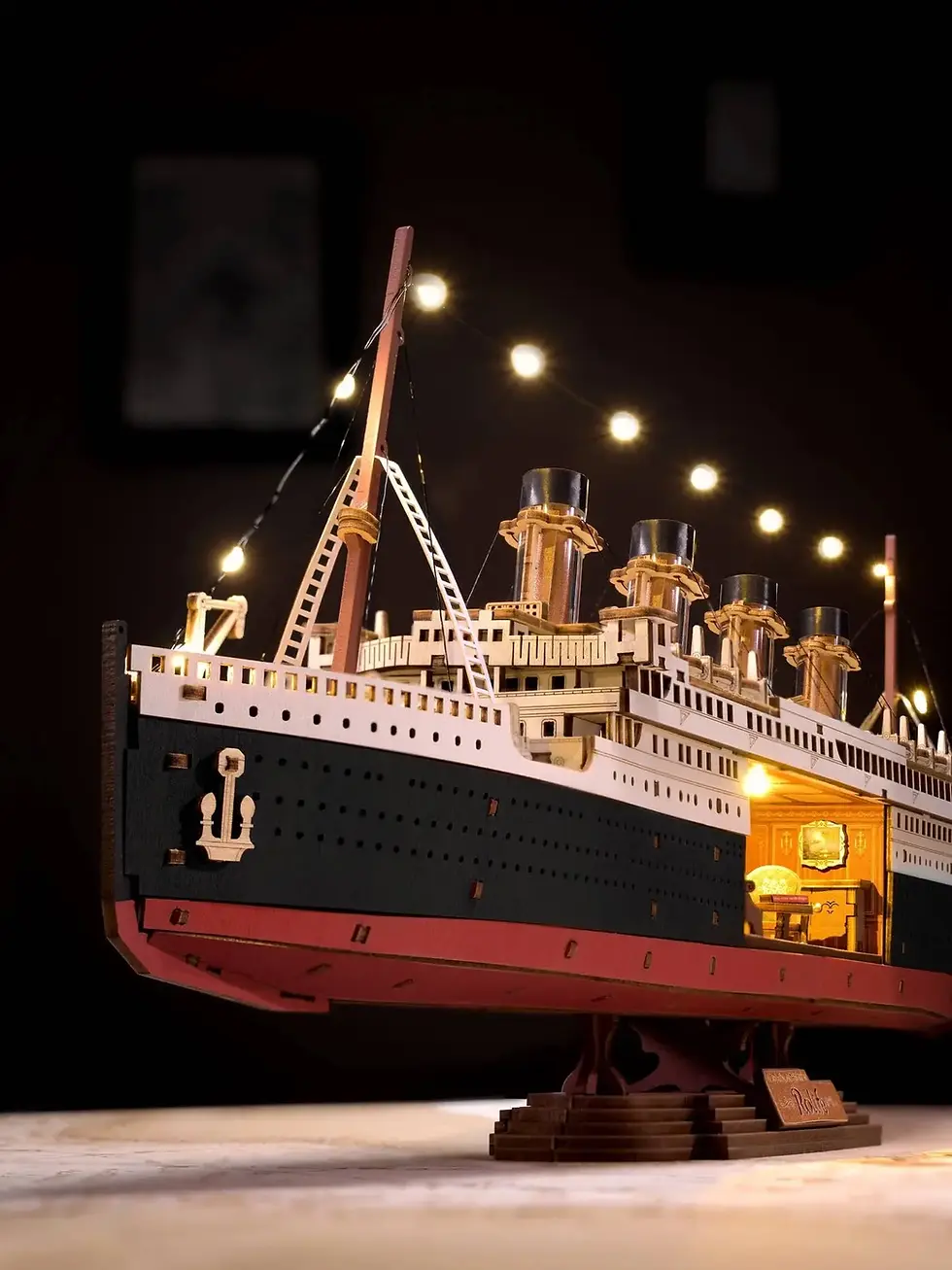 Thumbnail: 1912 Eternal Atlantic Voyager wooden puzzle set by Rolife with detailed ship hull, funnels, and illuminated cabins