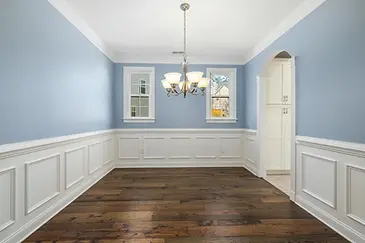 light blue painted wall in dining room