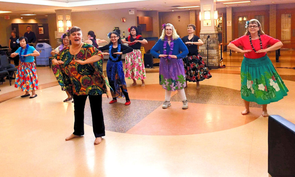 Group of women performing a hula dance