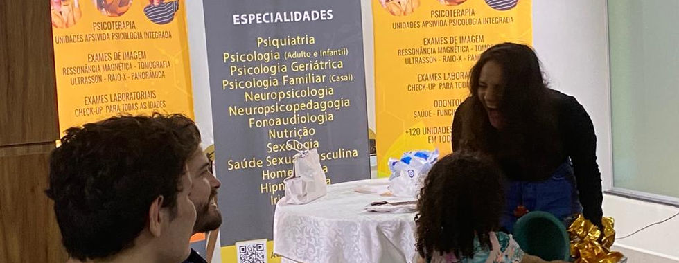 Joyi Vela clinic event: Woman interacting with child, services listed