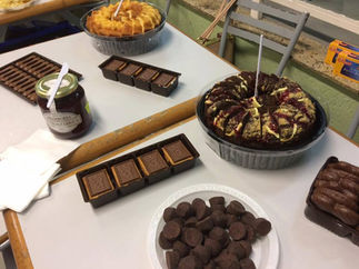 Assortment of cakes, chocolates, and cookies on table