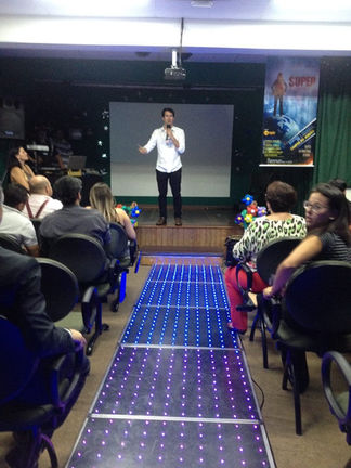 Alex giving a presentation to an audience