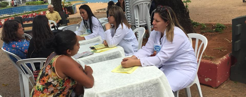 Doctors consulting patients outdoors