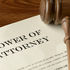 Power of Attorney document with a judge's gavel laying on top signifying a service member's POA.