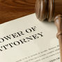 Power of Attorney document with a judge's gavel laying on top signifying a service member's POA.