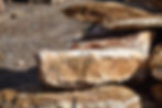 rusted white quartz boulder