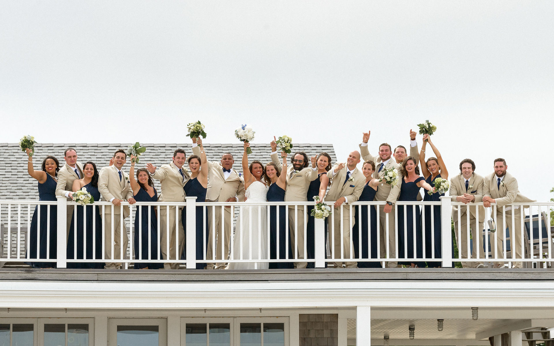 A wedding party on top of the Vineyard Haven Yacht Club photo by David Welch Photography