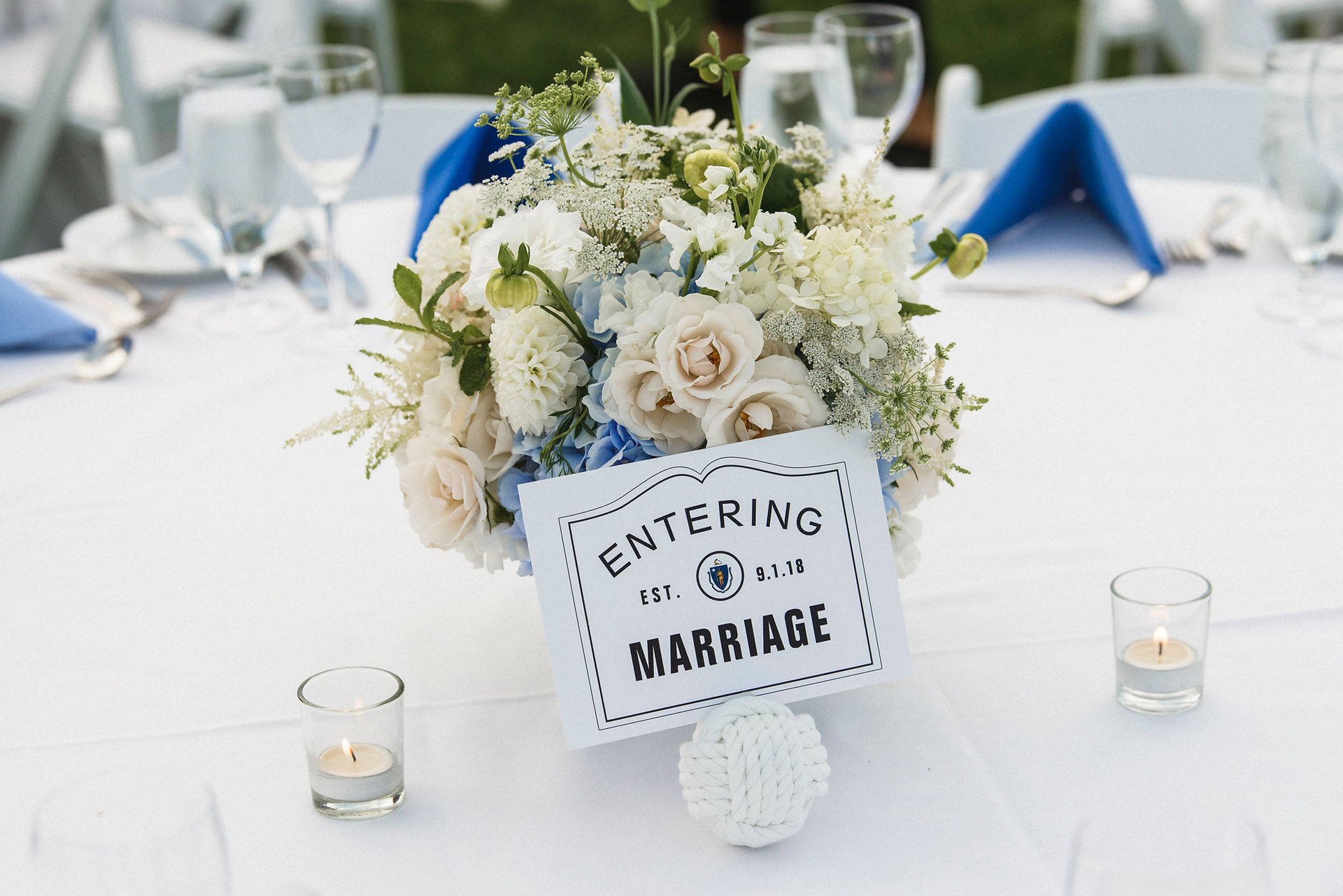 A wedding tablescape with flowers by Morrice Florist at the Harbor View Hotel on Martha's Vineyard photo by David Welch Photography