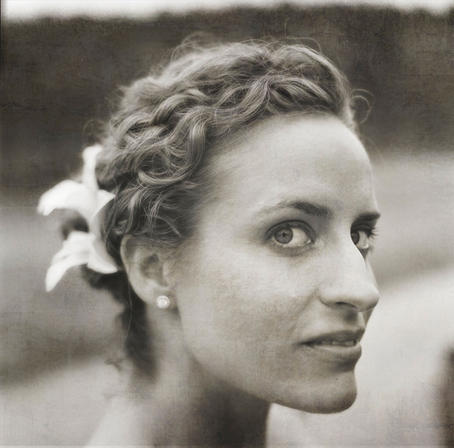 A bride poses for a photo by a Hasselblad 500CM photo by David Welch Photography