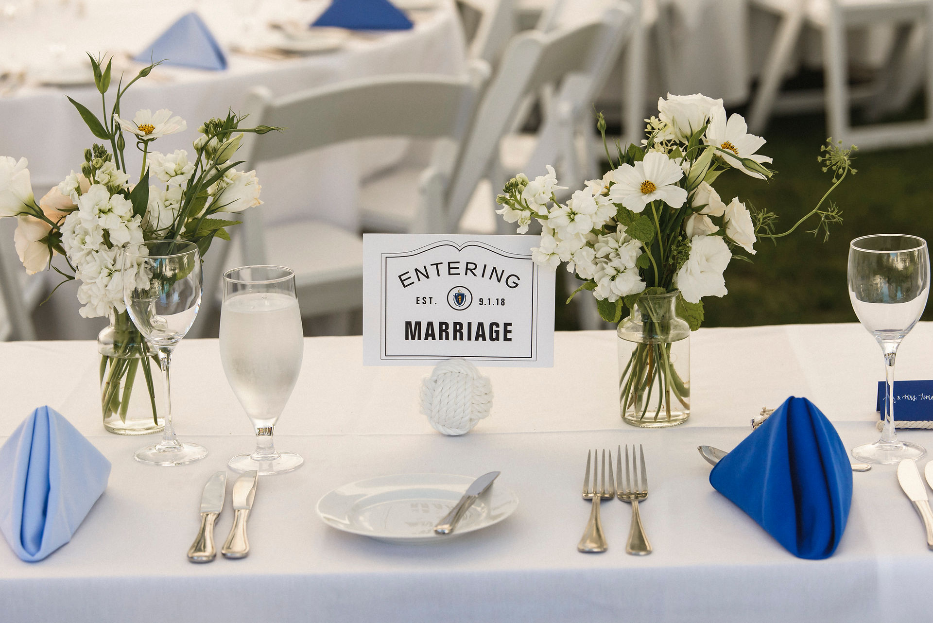 A wedding tablescape with flowers by Morrice Florist at the Harbor View Hotel on Martha's Vineyard photo by David Welch Photography