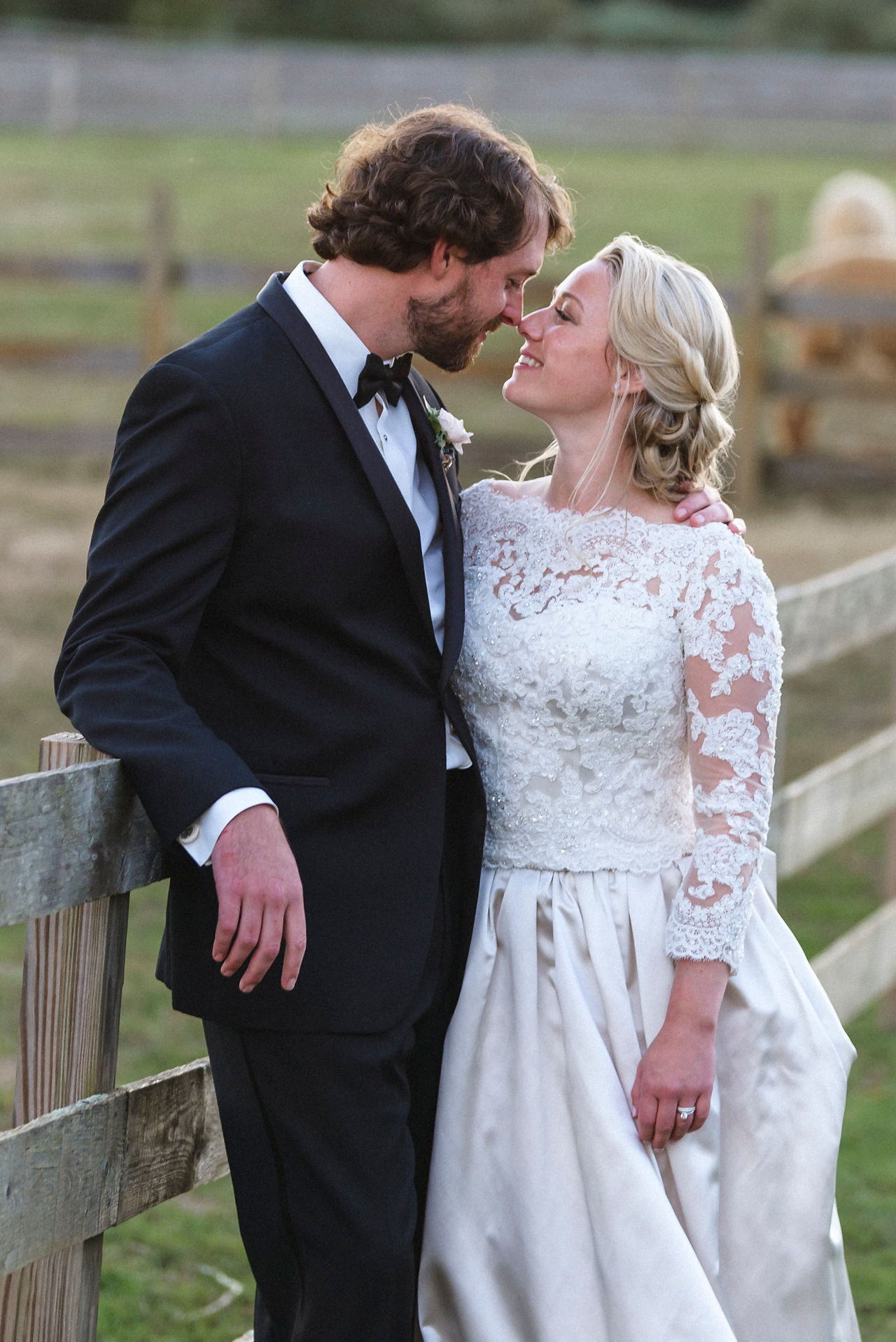 A bride and groom share a moment at their wedding at Island Alpaca Company on Martha's Vineyard photo by David Welch Photography