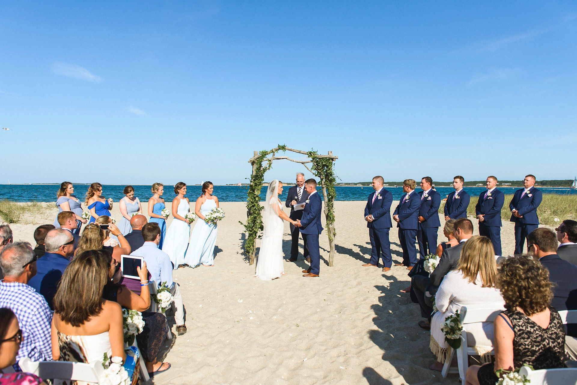 A wedding ceremony at Lighthouse Beach on Martha's Vineyard photo by David Welch Photography