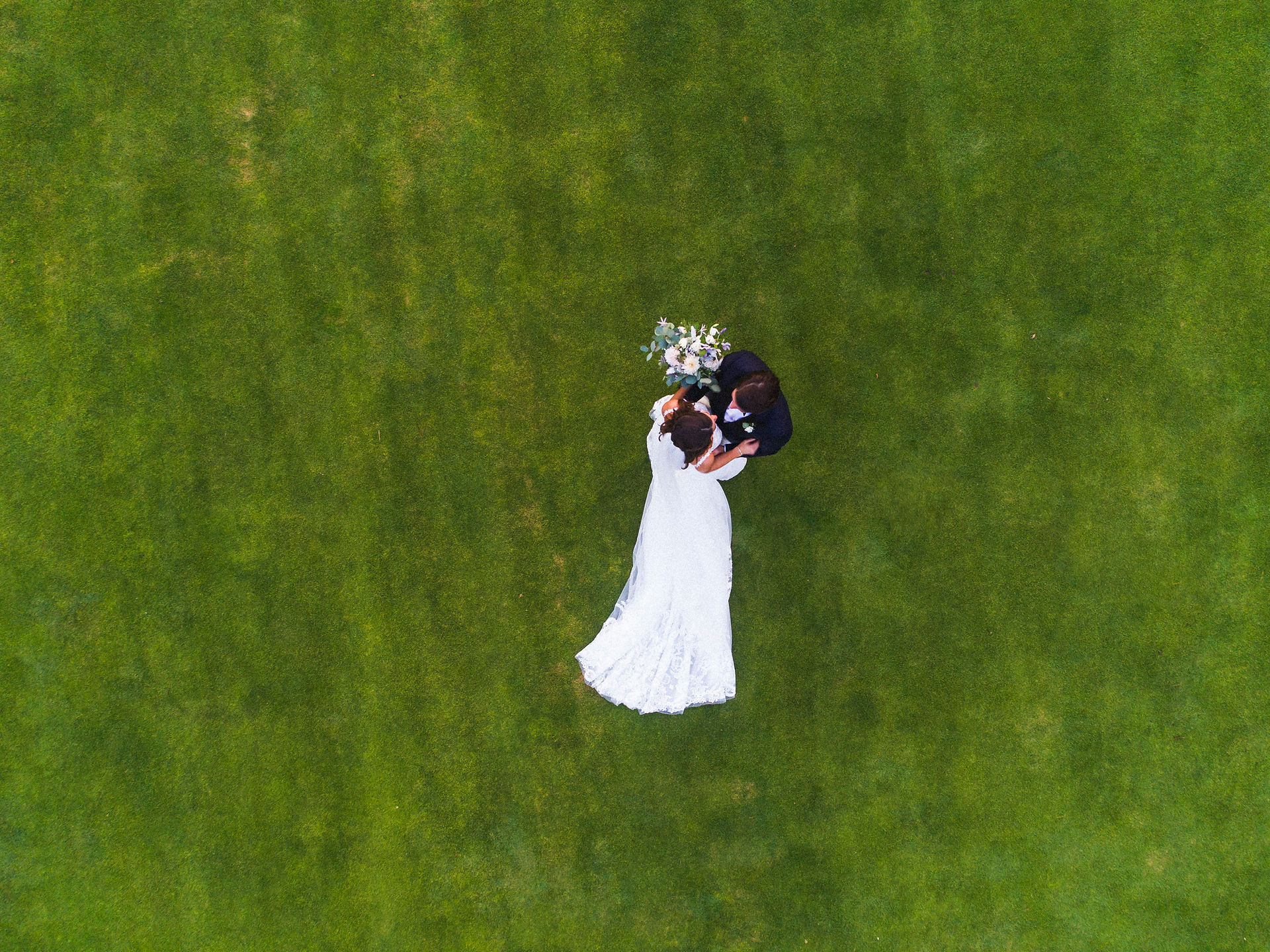A drone photo of a bride and groom at Farm Neck Golf club on Martha's Vineyard photo by David Welch Photography