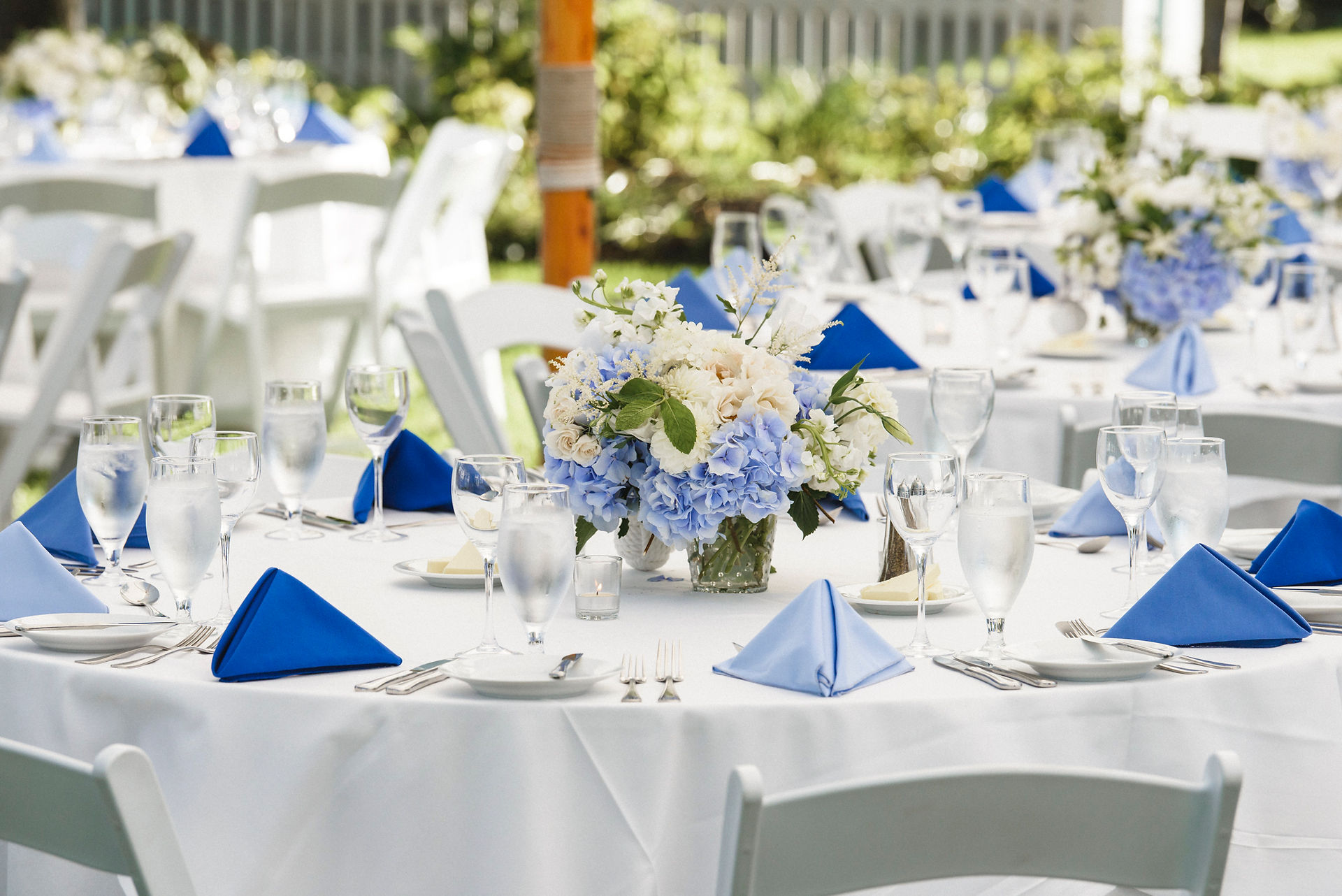A wedding tablescape with flowers by Morrice Florist at the Harbor View Hotel on Martha's Vineyard photo by David Welch Photography