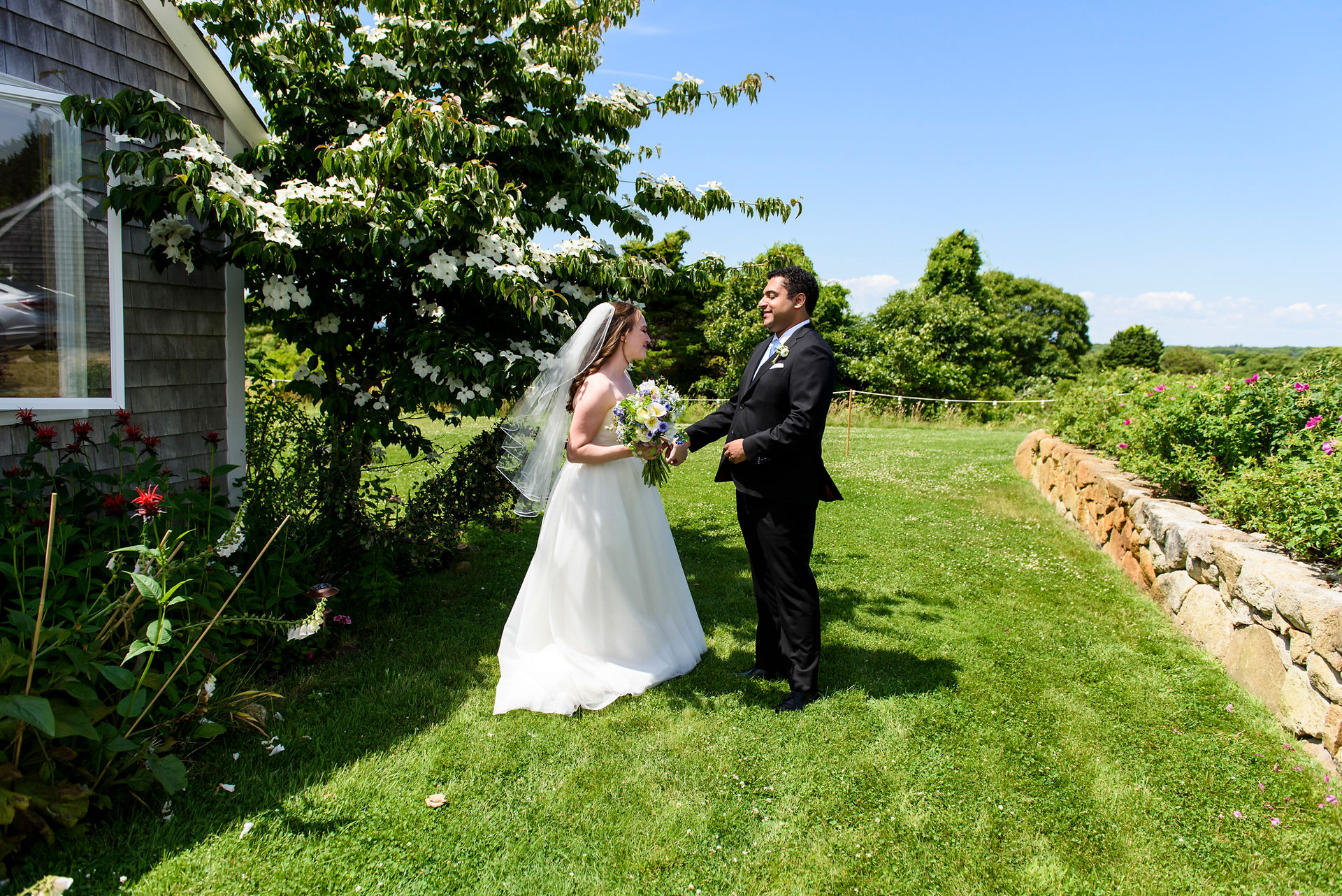 A bride and groom at their first look photo by David Welch Photography