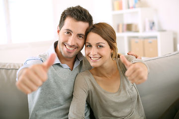Young couple showing thumbs up.jpg