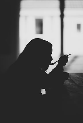 Shadow of a girl eating