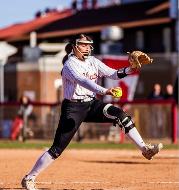 Olivia pitching during a softball game