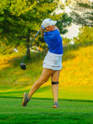 Mackenzie playing golf