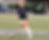 Kaylin dribbling a soccer ball during a game