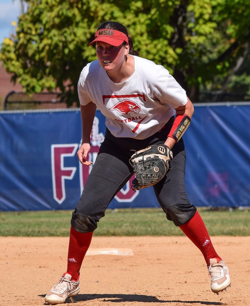 Molly playing softball