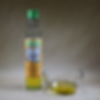 sesame oil mild toasted in a bowl with bottle next to it