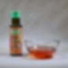 chili oil in a bowl and bottle next to it