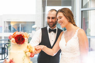 The bride and groom cut the cake!